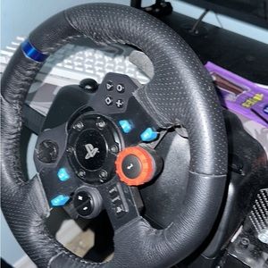 Logitech G 29 and if you want to add on a handbrake for a little extra